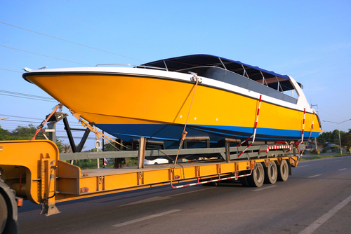 Truck,trailer,hitch,speedboat,on,new,ships.,running,on,the